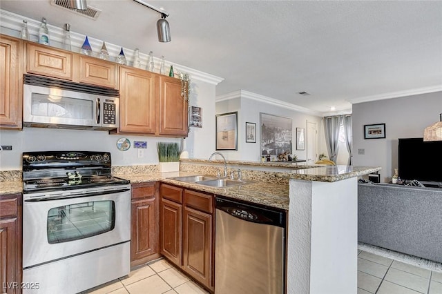 kitchen with sink, light tile patterned floors, crown molding, appliances with stainless steel finishes, and kitchen peninsula