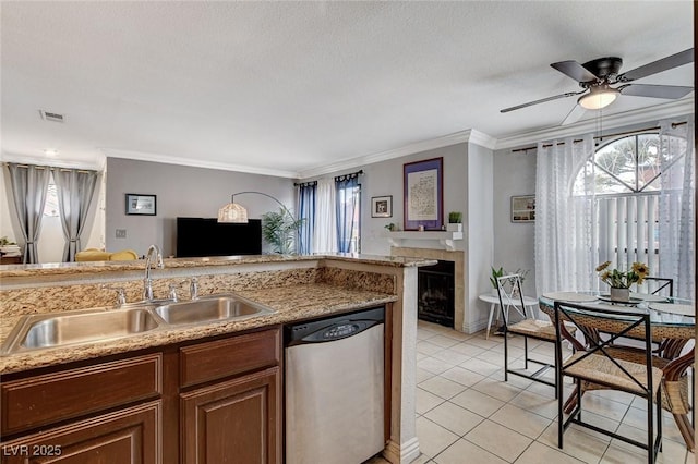 kitchen with light tile patterned flooring, sink, ornamental molding, dishwasher, and a healthy amount of sunlight