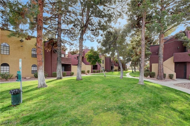 view of home's community with a lawn