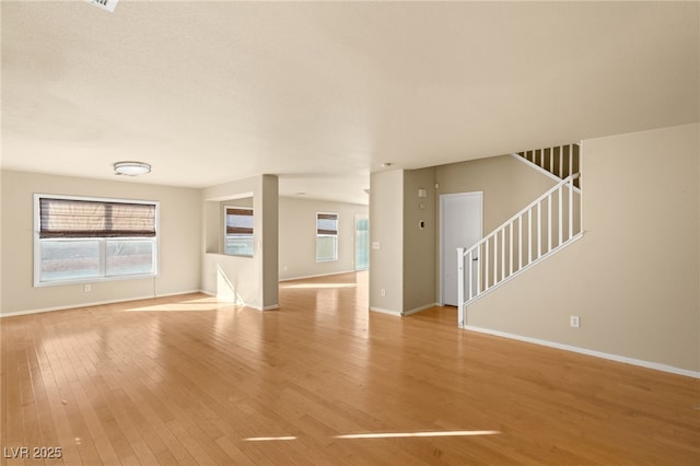 unfurnished living room with light wood-type flooring