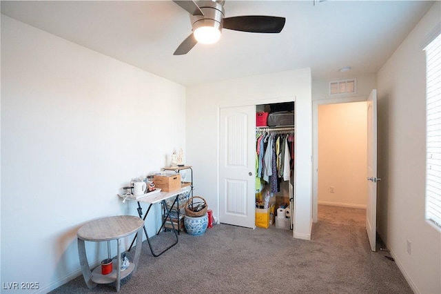 bedroom with carpet flooring, ceiling fan, and a closet