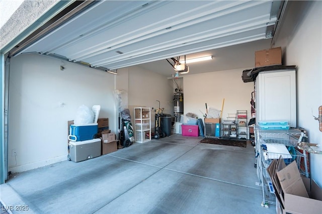 garage featuring a garage door opener and water heater