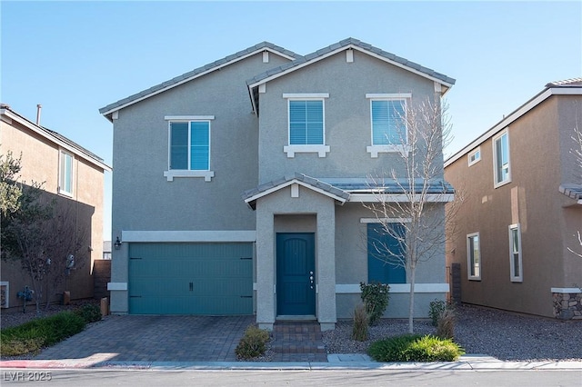 front of property with a garage