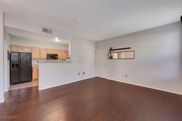 unfurnished living room with dark hardwood / wood-style floors