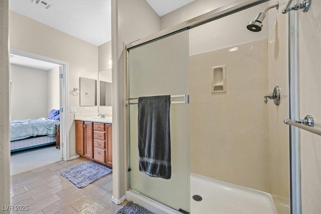 bathroom with vanity and an enclosed shower