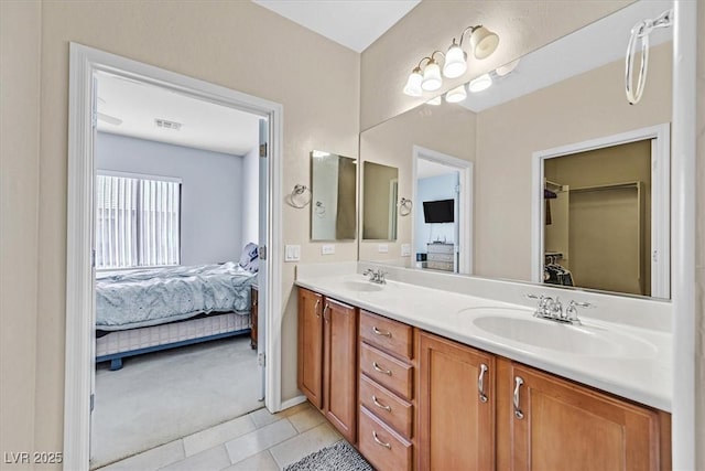 bathroom with vanity and tile patterned floors