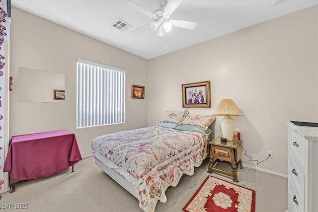 bedroom with light carpet and ceiling fan