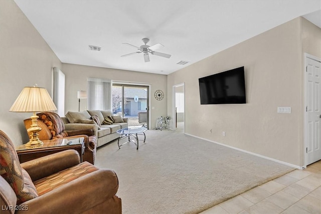 carpeted living room featuring ceiling fan