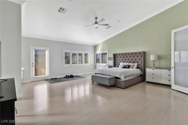 bedroom featuring lofted ceiling, ornamental molding, ceiling fan, and light wood-type flooring