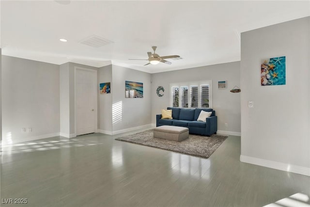 living room featuring hardwood / wood-style flooring, crown molding, and ceiling fan