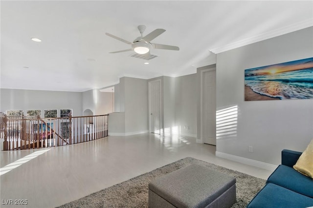 living room with crown molding and ceiling fan