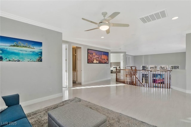 living room with ornamental molding, hardwood / wood-style floors, and ceiling fan