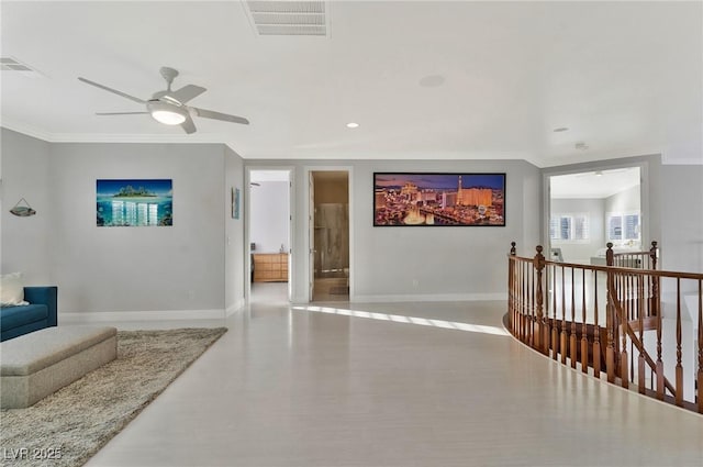 interior space featuring ornamental molding and ceiling fan