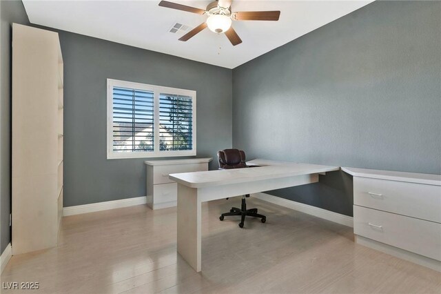 office space with ceiling fan and light wood-type flooring