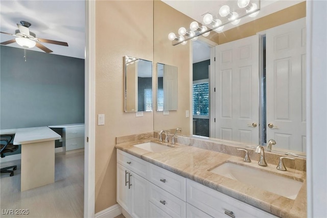 bathroom with ceiling fan and vanity