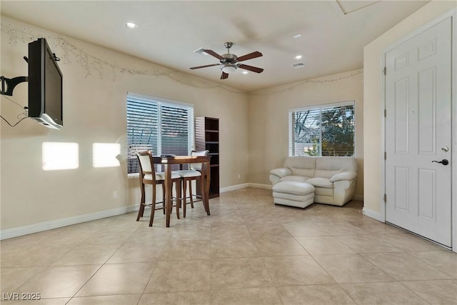 living room with light tile patterned floors and ceiling fan