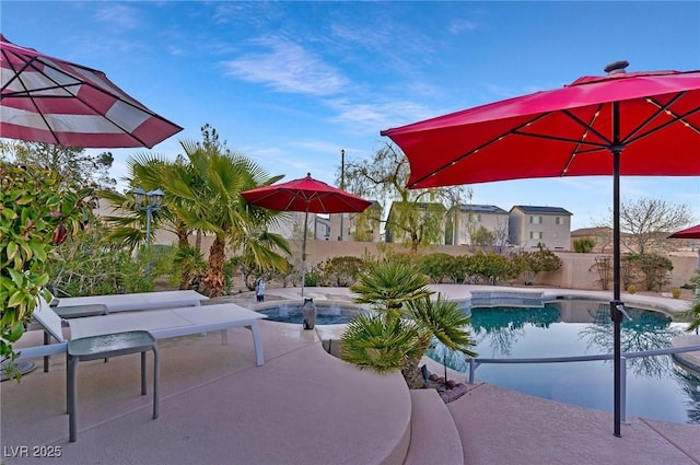 view of swimming pool featuring a patio area