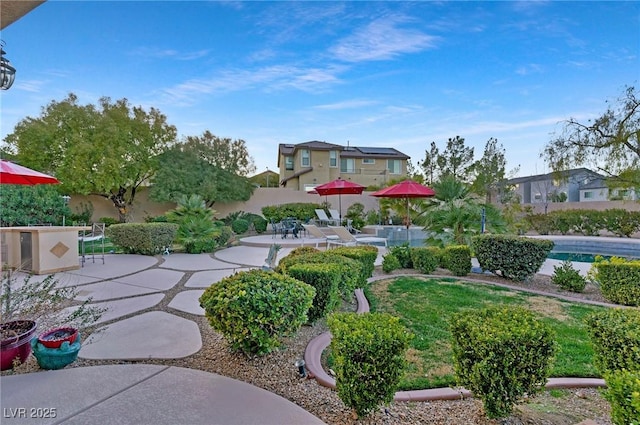 view of community with a swimming pool and a patio