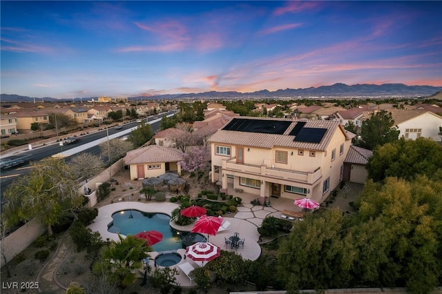 aerial view at dusk with a mountain view