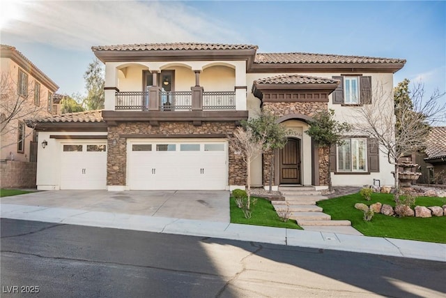 mediterranean / spanish home featuring a balcony and a garage