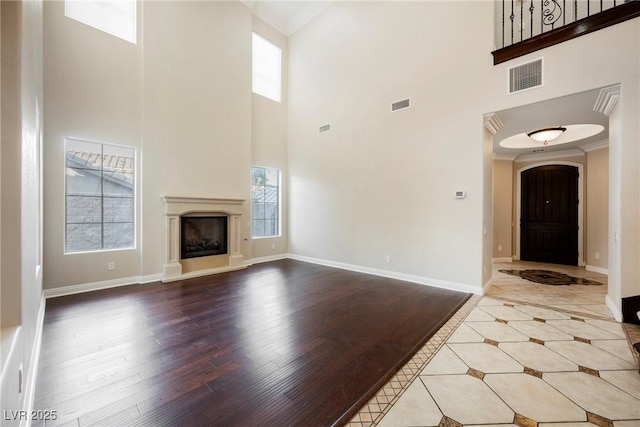 unfurnished living room with wood-type flooring