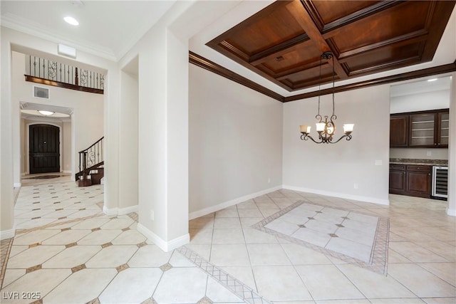 unfurnished room featuring coffered ceiling, light tile patterned floors, ornamental molding, and beverage cooler