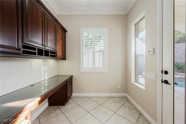 interior space with light tile patterned floors and crown molding