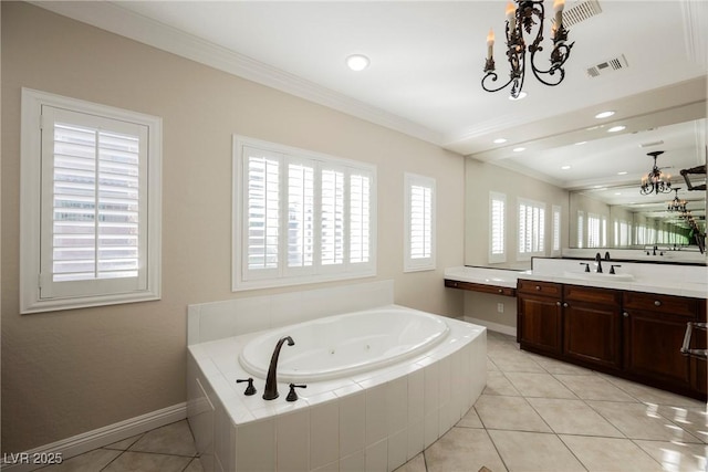 bathroom with vanity, ornamental molding, tiled tub, tile patterned floors, and an inviting chandelier