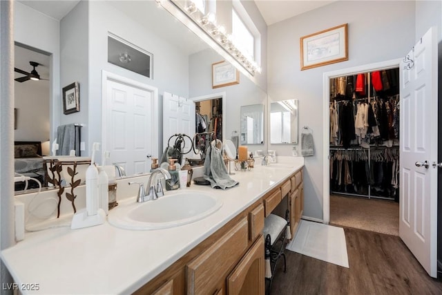 bathroom with vanity, hardwood / wood-style flooring, and ceiling fan