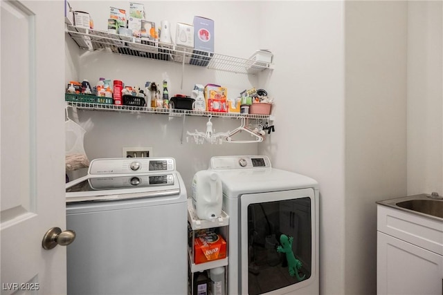 washroom with washing machine and dryer