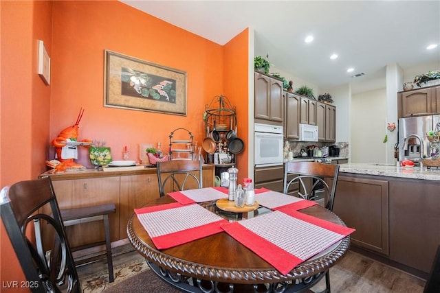 dining area featuring dark hardwood / wood-style flooring