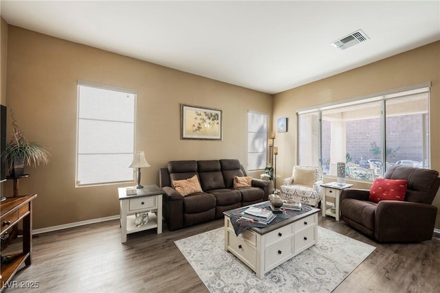 living room featuring dark wood-type flooring