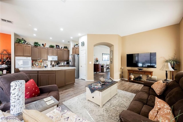 living room with light hardwood / wood-style flooring