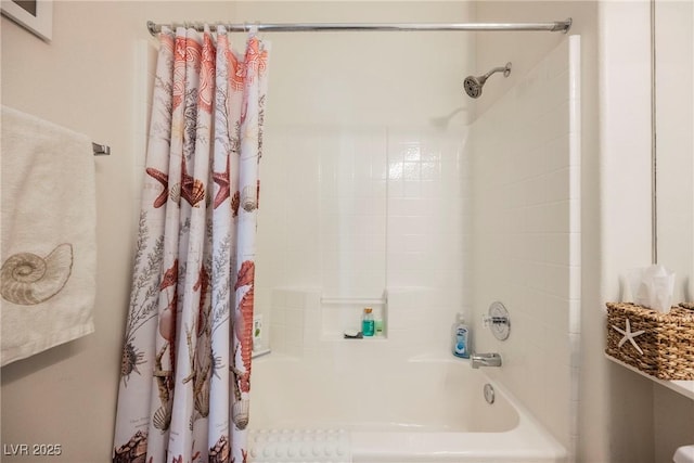 bathroom with shower / tub combo with curtain