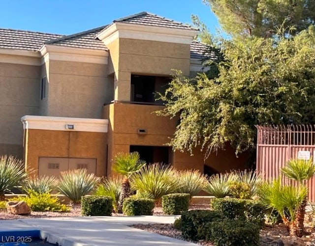 view of building exterior featuring fence