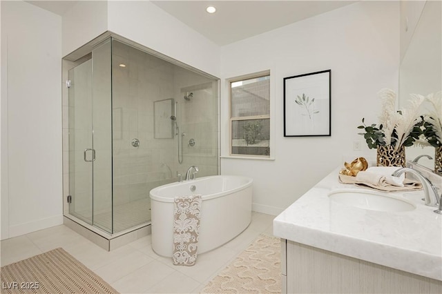 bathroom featuring independent shower and bath, vanity, and tile patterned flooring