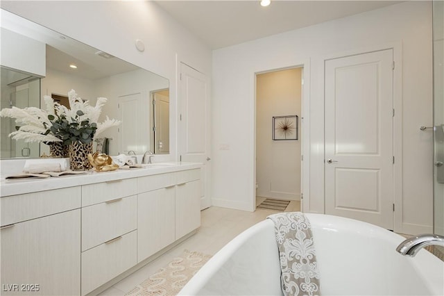 bathroom with vanity and a bathtub