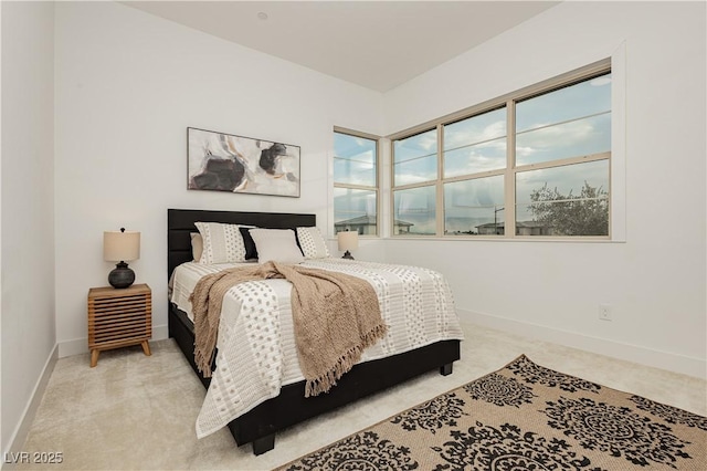 bedroom featuring light colored carpet