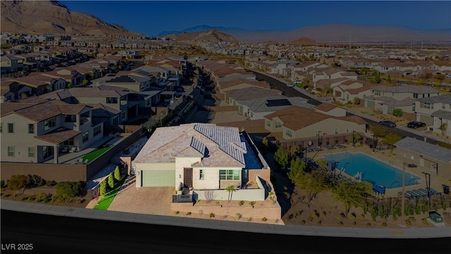 birds eye view of property with a mountain view