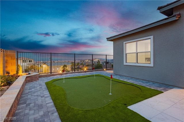 view of yard at dusk