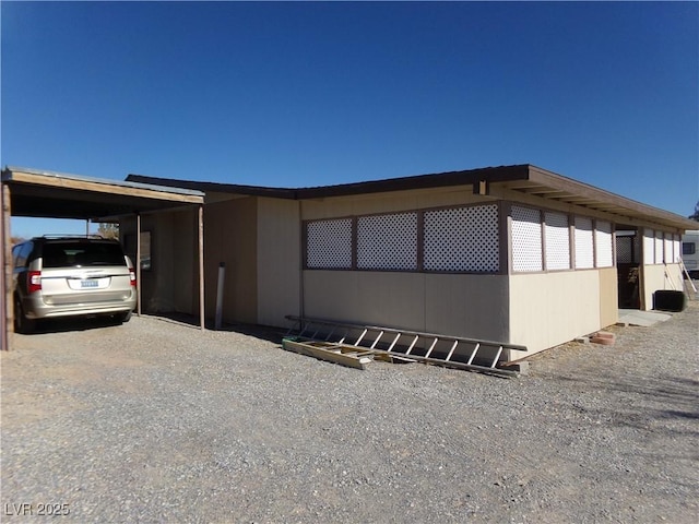 view of home's exterior featuring a carport