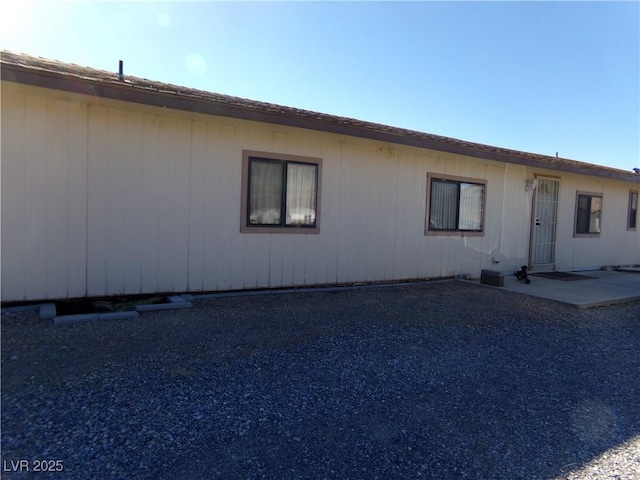 view of side of property featuring a patio