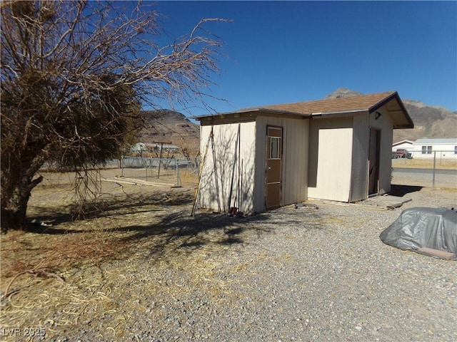 view of shed with fence