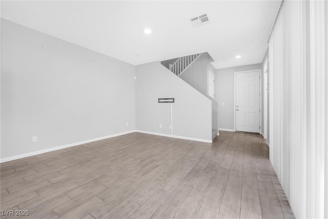 unfurnished living room with light wood-type flooring