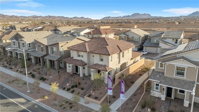 birds eye view of property featuring a mountain view