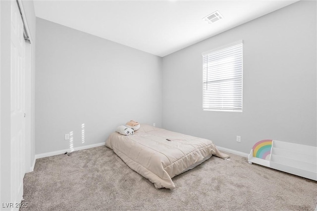 bedroom with light carpet