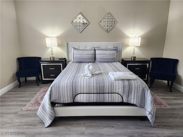 bedroom with wood-type flooring