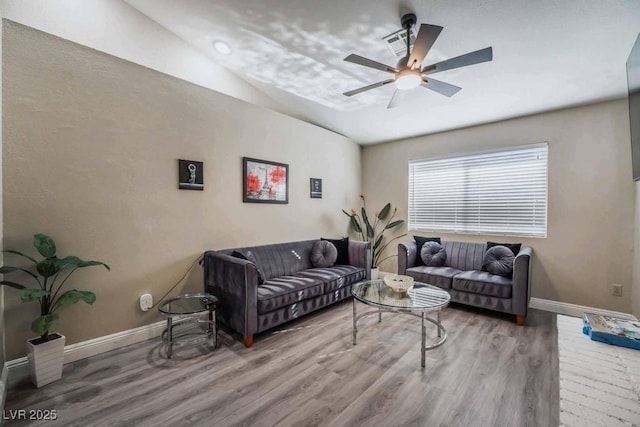 living room with ceiling fan and hardwood / wood-style floors