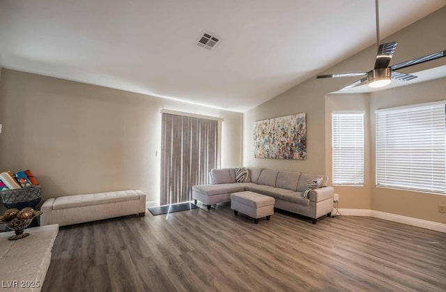 living room featuring lofted ceiling, hardwood / wood-style flooring, and ceiling fan