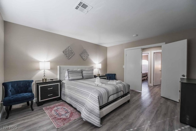 bedroom with hardwood / wood-style flooring